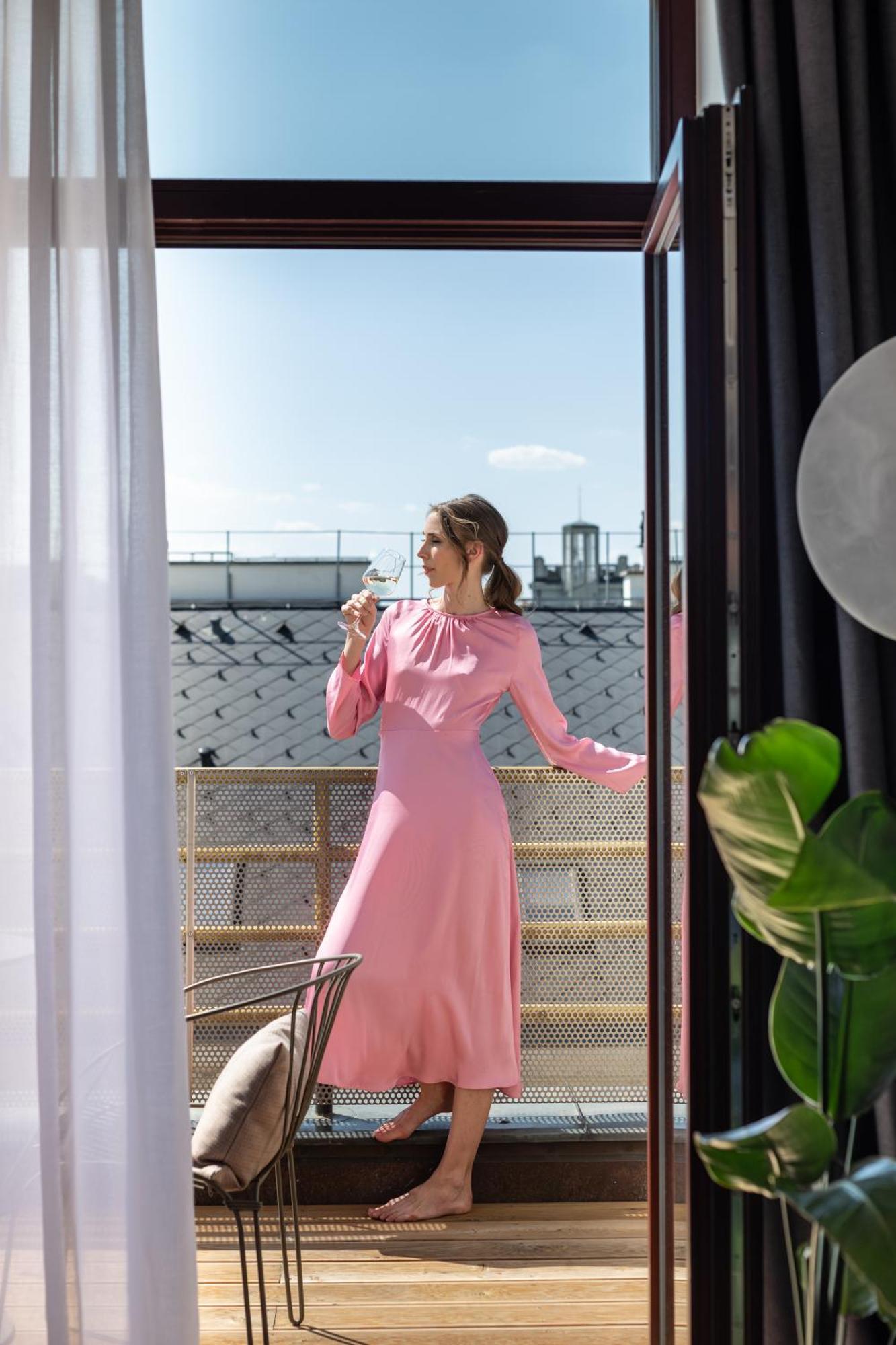 Almanac X Alcron Prague Hotel Exterior photo A woman wearing a pink dress